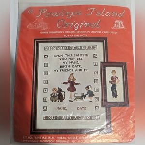 Counted cross stitch boy or girl motif kit with thread.